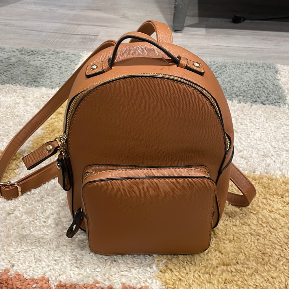 Compact Tan Leather Backpack with Adjustable Straps